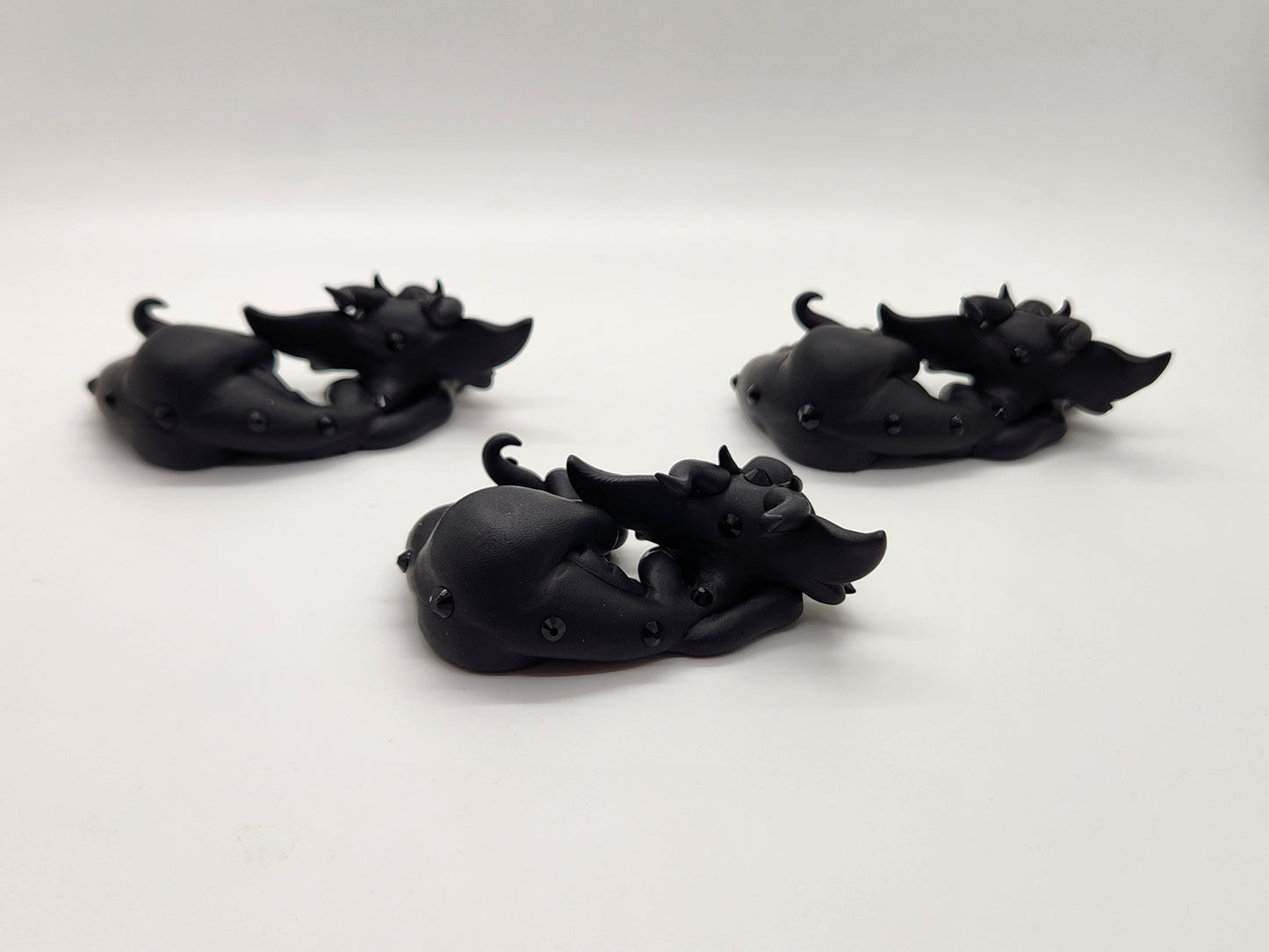 "Buio" black baby drake dragon sculptures