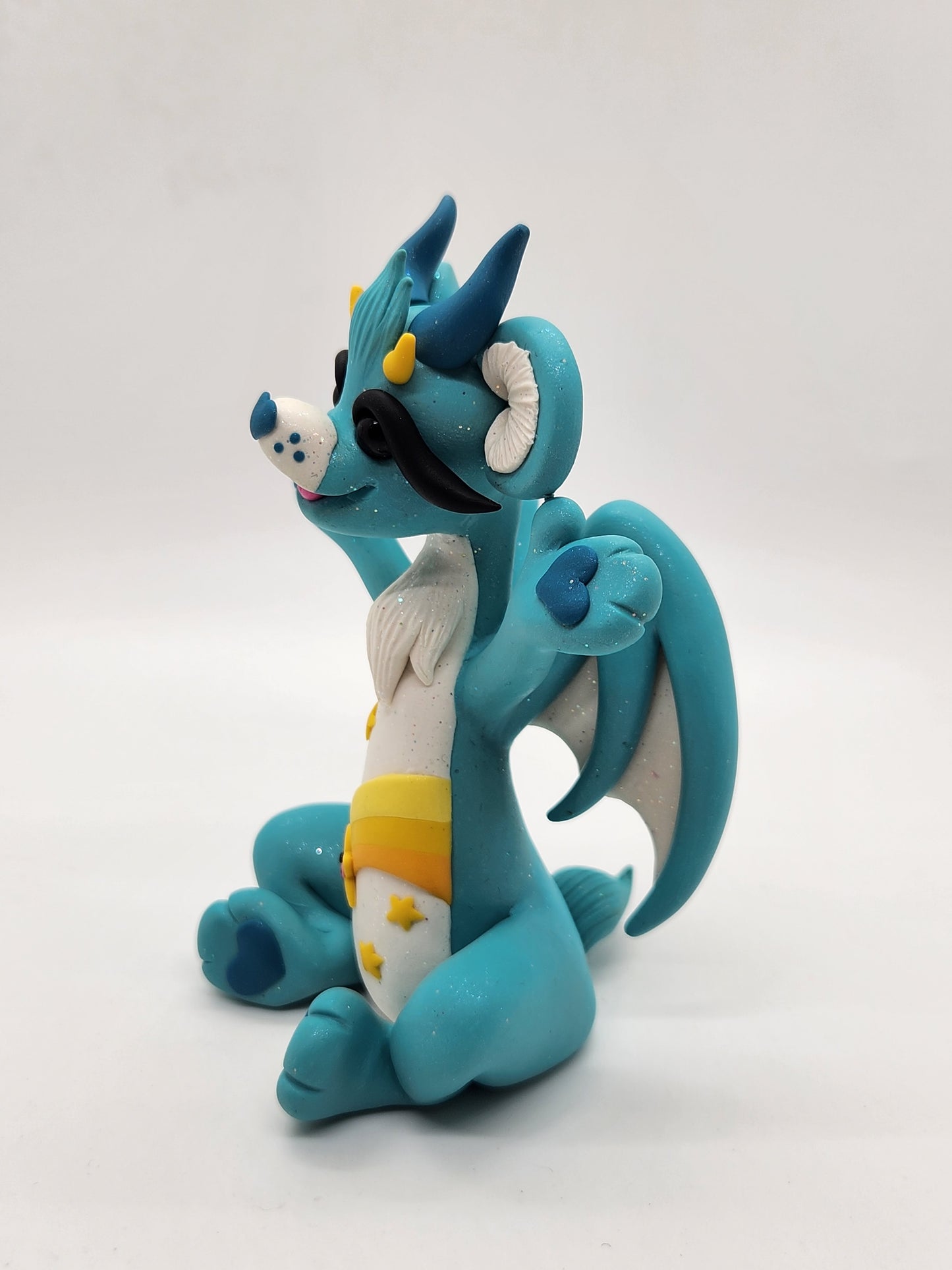 "Wish" blue and yellow care bear dragon sculpture