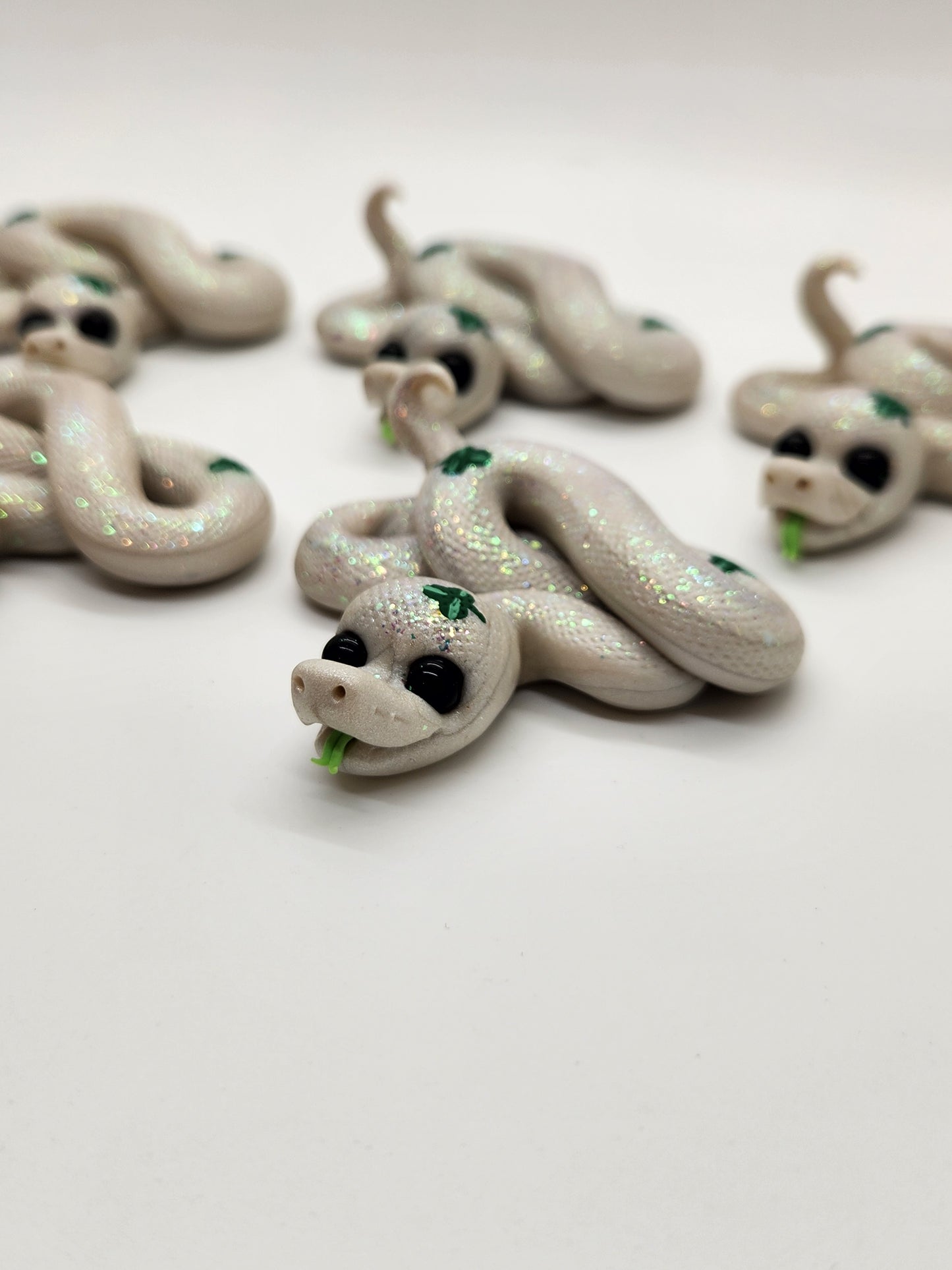 "Nathair" white and green snake sculpture