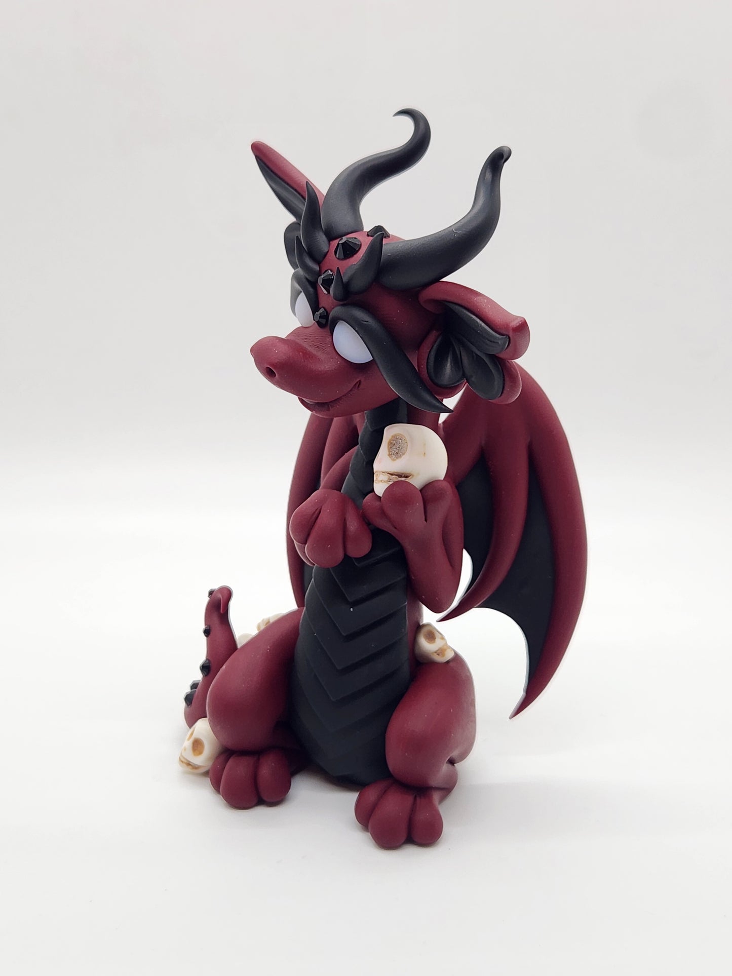 "Surnud" red and black skulls dragon sculpture