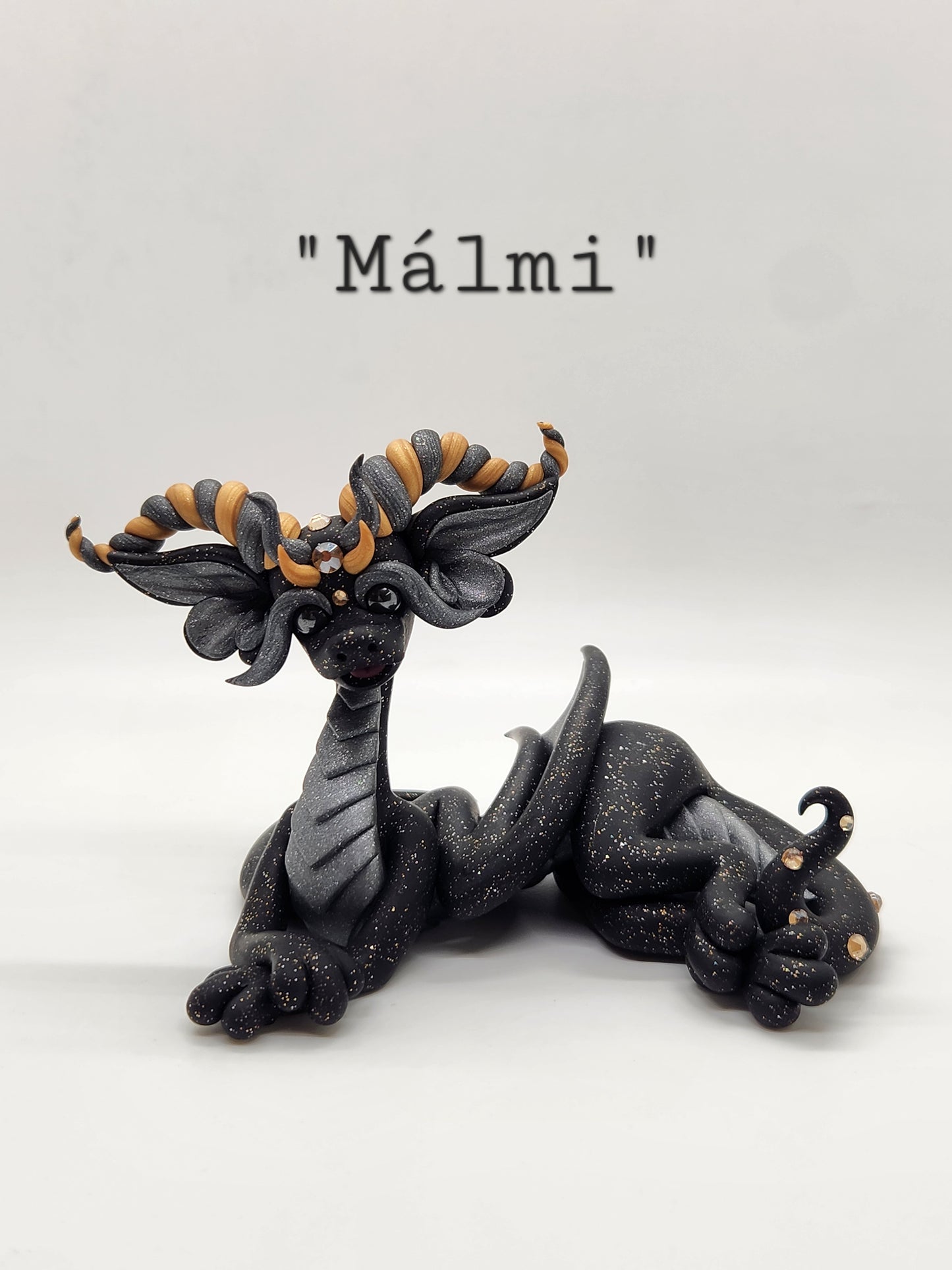 "Málmi" black silver and gold dragon sculpture