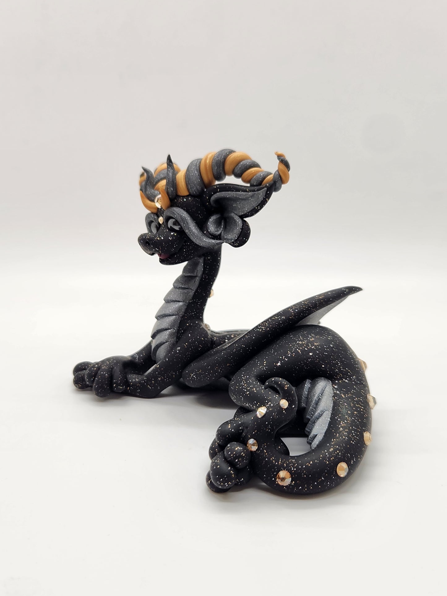 "Málmi" black silver and gold dragon sculpture