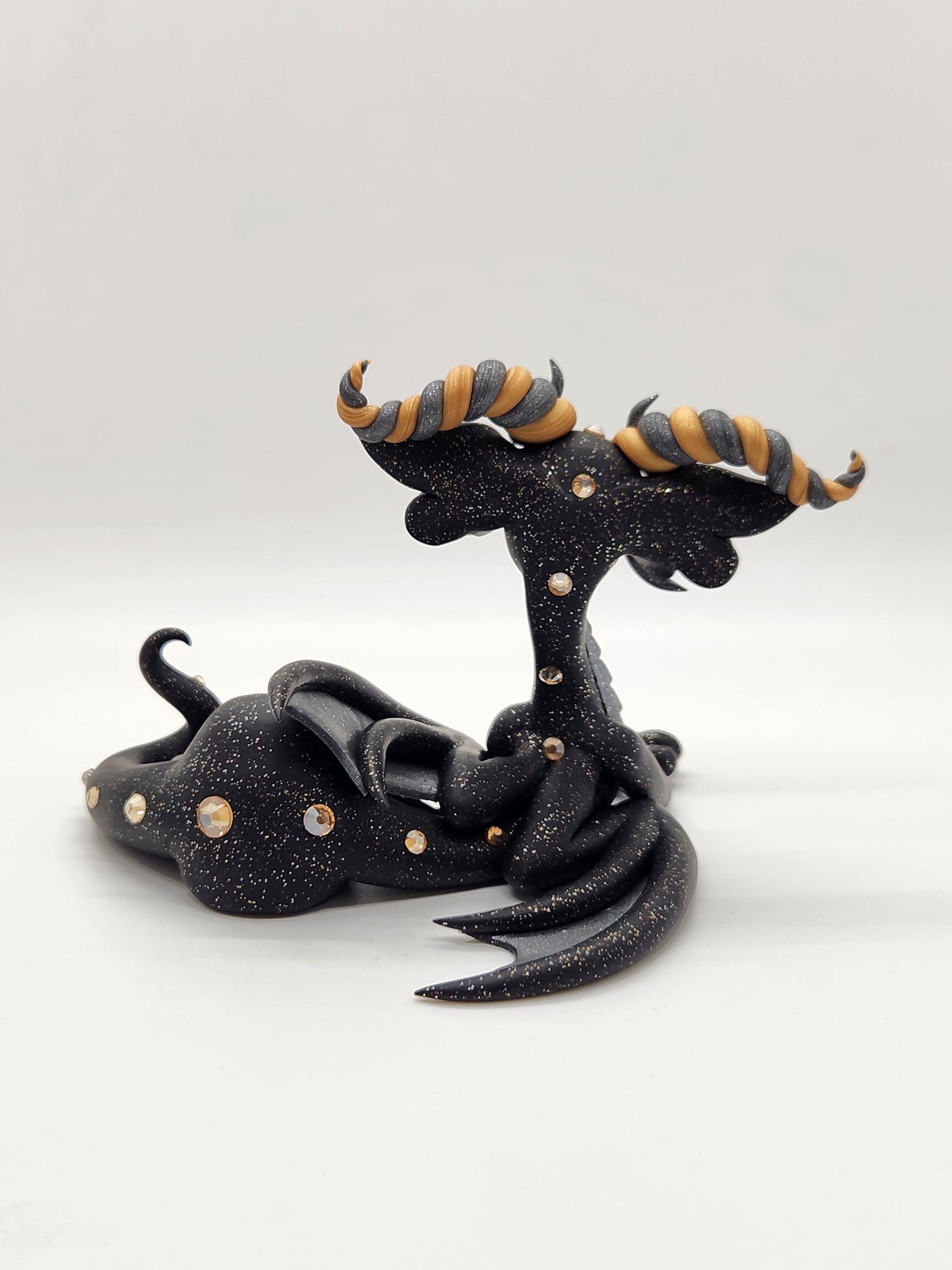 "Málmi" black silver and gold dragon sculpture