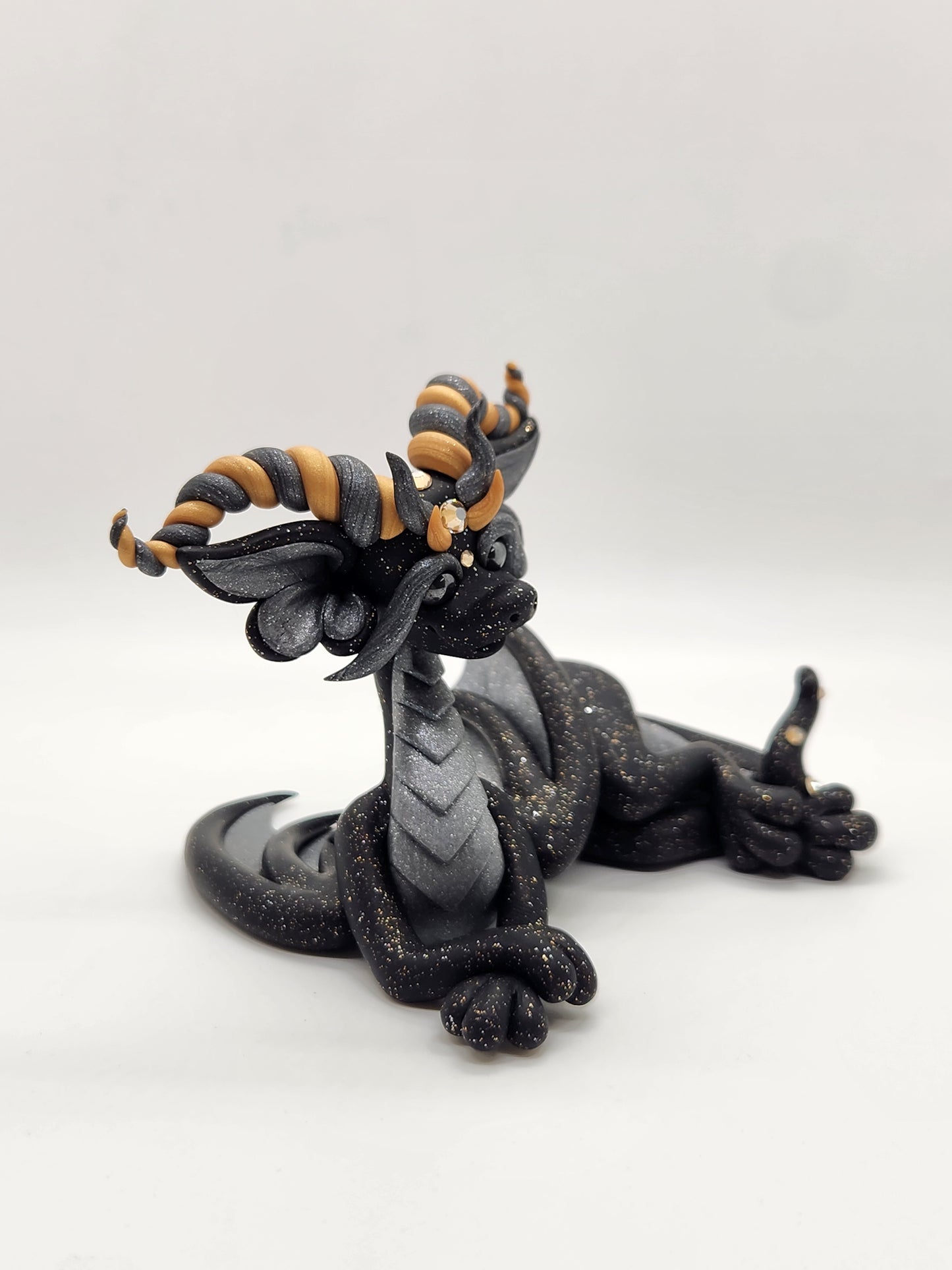 "Málmi" black silver and gold dragon sculpture