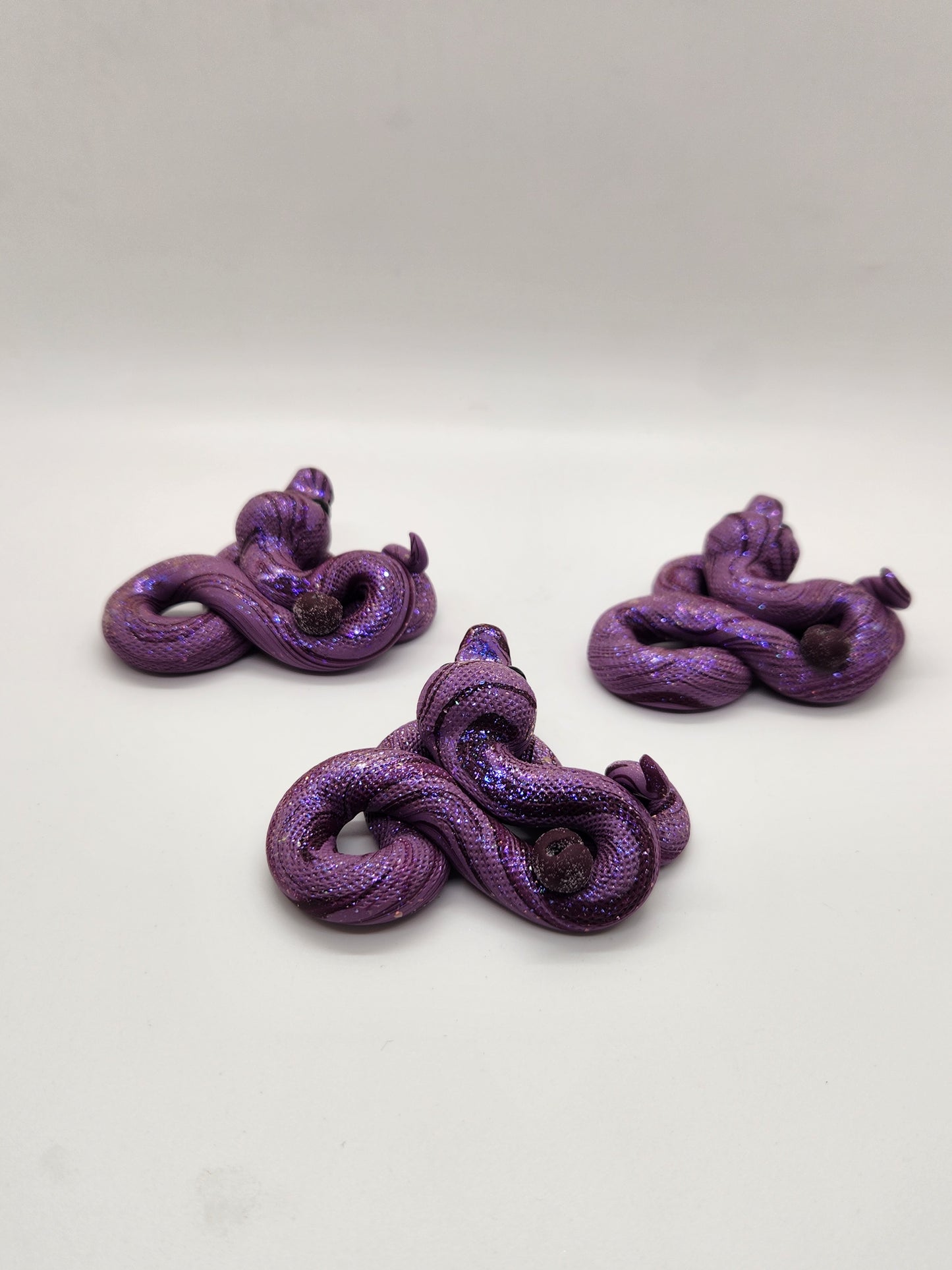 "Blomme" sugar plum snake sculpture