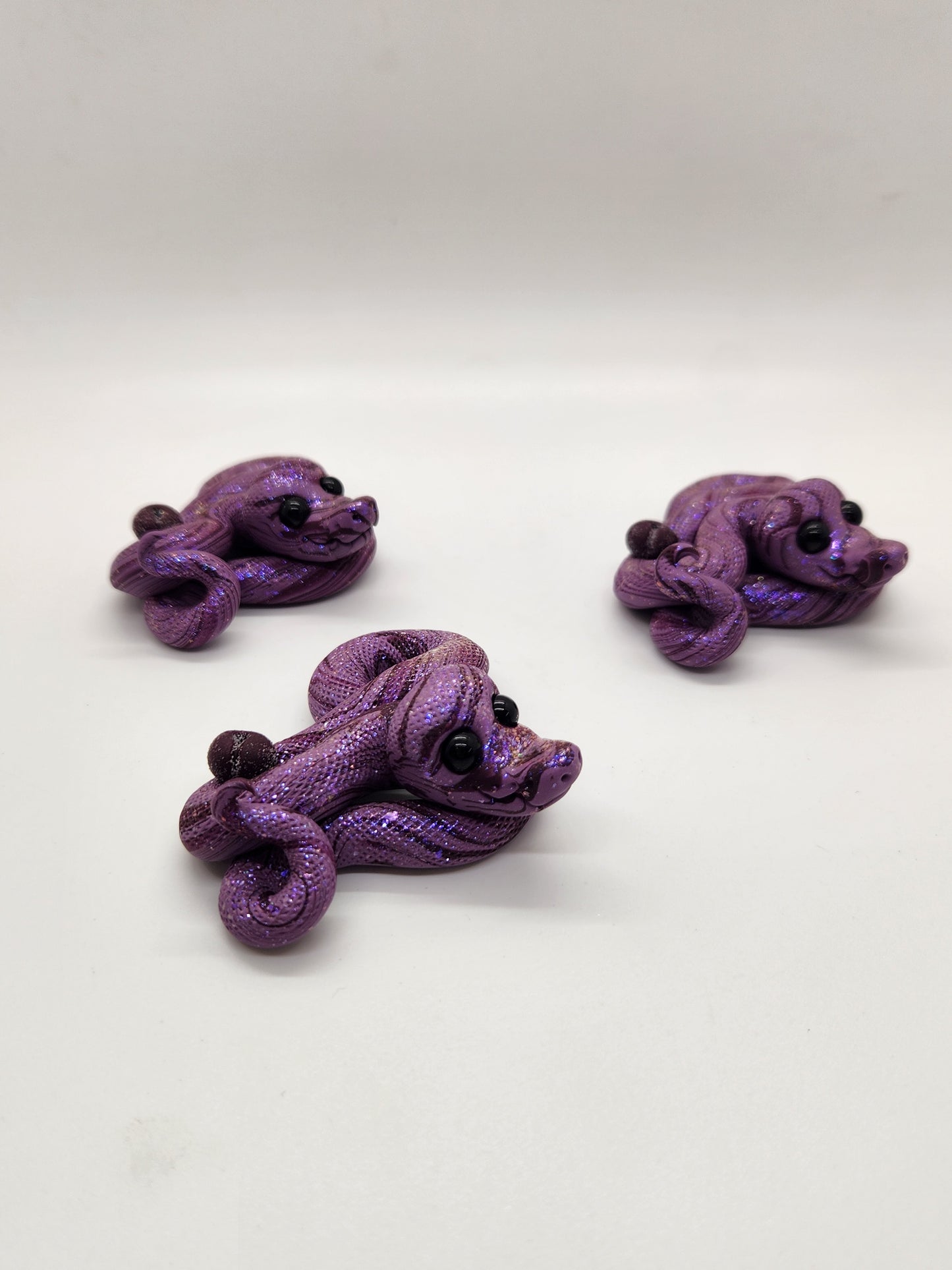 "Blomme" sugar plum snake sculpture