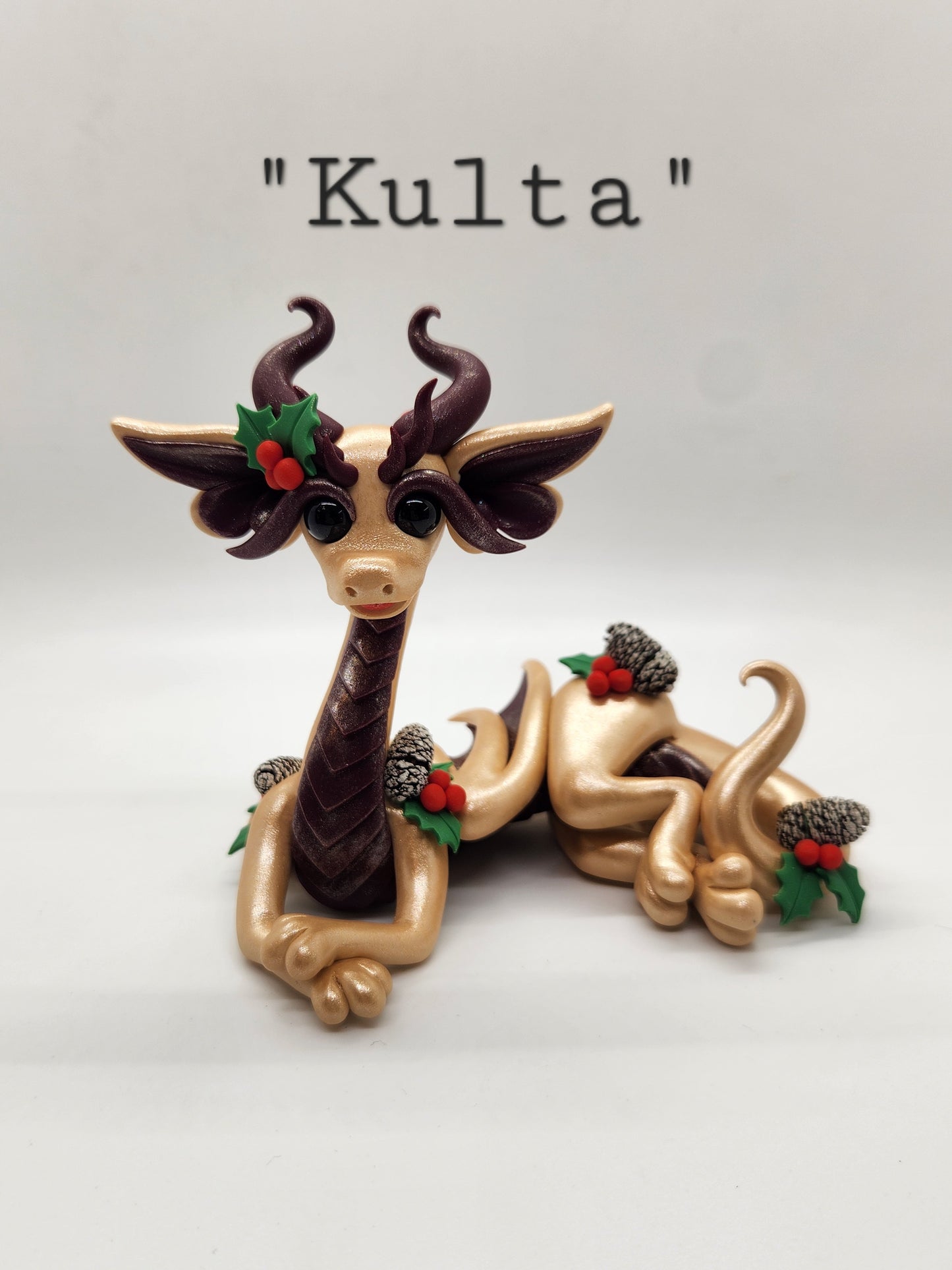 "Kulta" gold Yule dragon sculpture