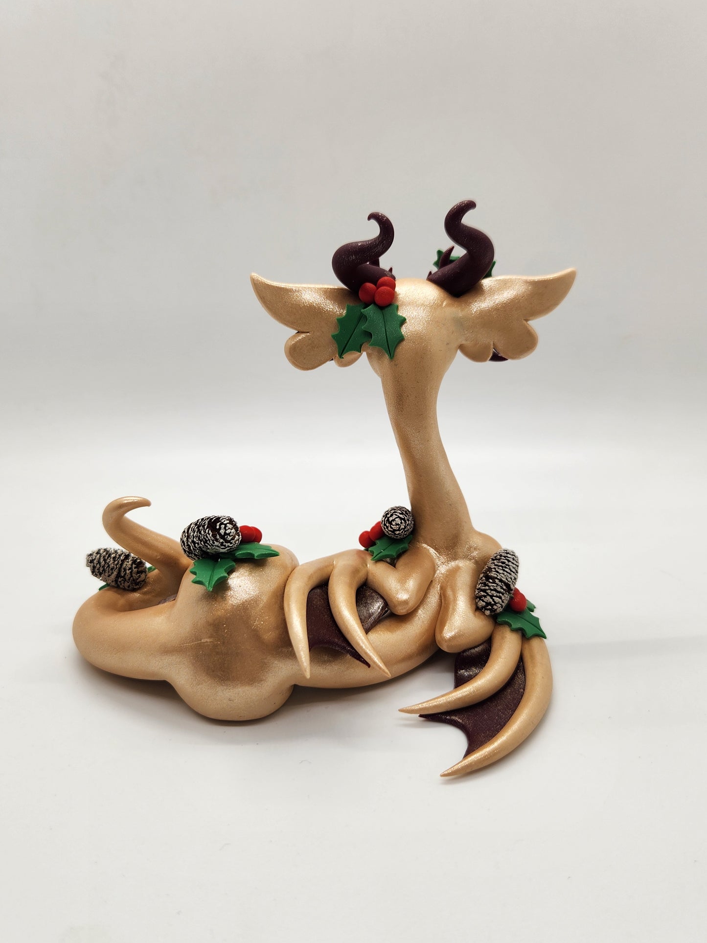 "Kulta" gold Yule dragon sculpture