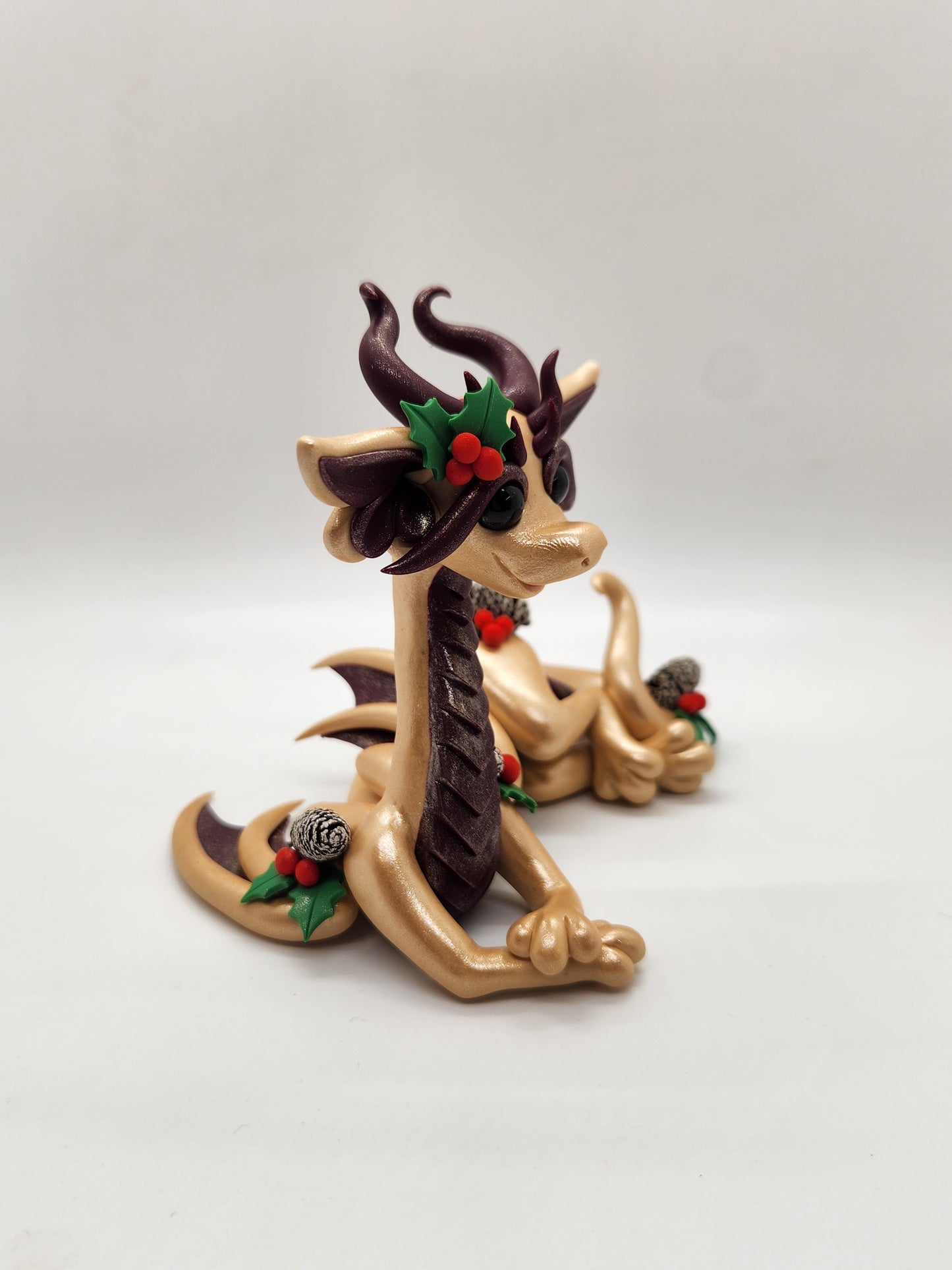 "Kulta" gold Yule dragon sculpture